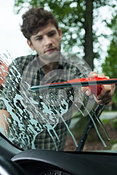 Cleaning windscreen in a car