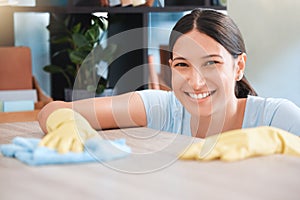 Cleaning, woman or portrait happy cleaner with cloth and gloves for dusty, messy or dirty bacteria on wooden table