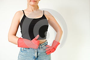 Cleaning woman with red rubber gloves on a white background. Red glove for cleaning on a female hand shows thumb up