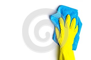 cleanliness and cleaning. females hand in yellow gloves and blue cleaning cloth