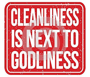 CLEANLINESS IS NEXT TO GODLINESS, words on red stamp sign photo