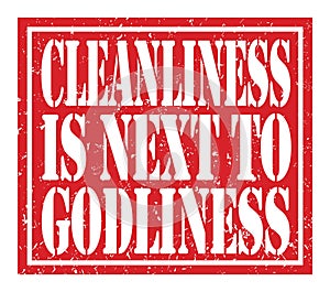 CLEANLINESS IS NEXT TO GODLINESS, text written on red stamp sign photo