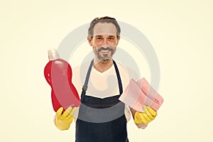 Cleanness is in his hands. Mature household helper. Mature household worker holding laundry detergent in rubber gloves