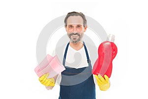 Cleanness is in his hands. Mature household helper. Mature household worker holding laundry detergent in rubber gloves photo