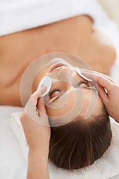 The cleansing of body and mind. a beautiful young woman receiving a facial treatment.