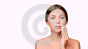 Cleansing face wasing tonic. Demakeup. remove mascara. Cotton pad hand photo