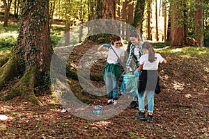 Cleanup volunteers collecting trash in the forest