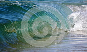 Clear blue barreling surf