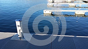 Clear blue fjord under empty dock