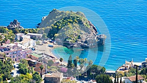 Clear blue sea, comfortable hotels and beach near Isola Bella in Taormina, Sicily, Italy