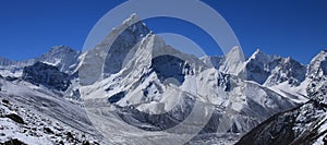 Clear blue sky over snow covered Mount Ama Dablam
