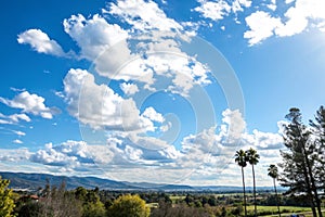 Clear blue sky with white clouds photo