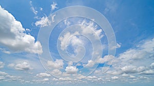 Clear blue sky with white fluffy clouds at noon. Day time. Abstract nature landscape background