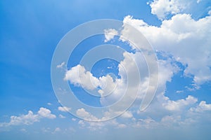 Clear blue sky with white fluffy clouds at noon. Day time. Abstract nature landscape background