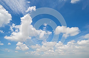 Clear blue sky with white fluffy clouds at noon. Day time. Abstract nature landscape background