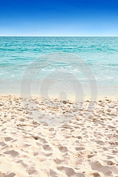 Clear blue water and soft sandy beach