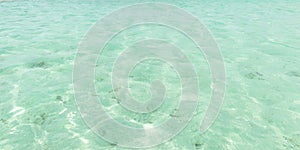 Clear Caribbean sea water surface at Nylon Pool Tobago West Indies shallow depth photo