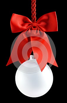 Clear Christmas ornament hanging from shiny red ribbon and bow. Empty space in bauble for text or product. Isolated on black