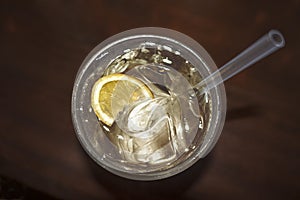 Cocktail drink with lemon silice clear liquid photo