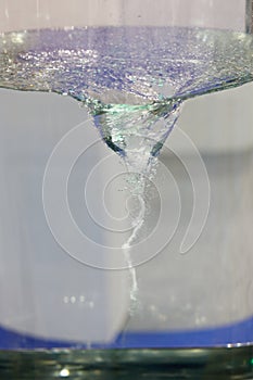 Clear colorless liquid mixing in magnetic stirrer photo