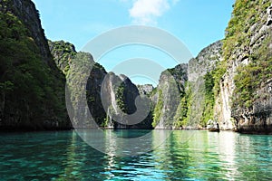 Clear crystal green sea high mountain cliffs phi phi island Thailand