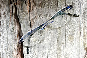 Glasses rimless frame contemporary style on grungy wood background