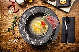 Clear Fish soup served in a bowl in restaurant