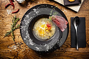 Clear Fish soup served in a bowl in restaurant