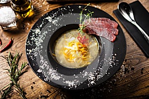 Clear Fish soup served with slices of tuna in a bowl. Delicious healthy Italian traditional food closeup served for