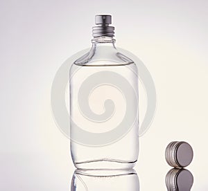 Clear fragrance bottle on white background.