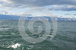 Clear fresh water and panorama of Lake Baikal on a summer day.