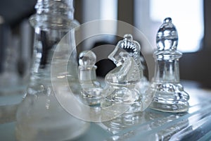 Clear glass chess and business concept