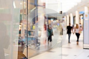 Clear glass for logo mockup, branding presentation in shooping mall photo