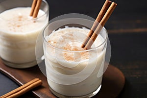 clear glass of rice pudding drink with a twisty straw