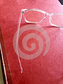 Clear glasses and a folder