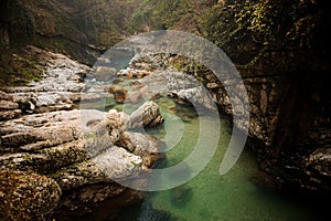 Clear green mountain river in Georgia. Martvili canyon. Okatse canyon