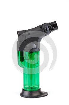 Clear green plastic gas lighter. Gas lighter isolated on white background. Close-up gas burner