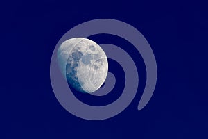 Clear image of waxing gibbous moon on clear blue evening