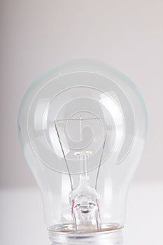 Clear light bulb with filament showing close up