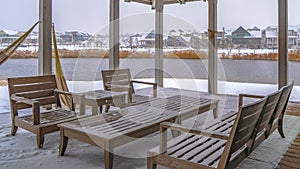 Clear Panorama Snowy patio of a clubhouse overlooking Oquirh Lake