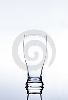 Clear Pilsner Glass on white background