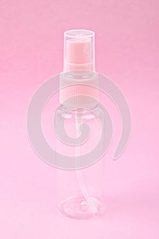 Clear pink plastic bottle spray
