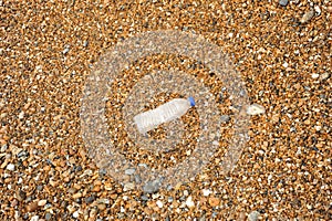 Clear plastic Bottle washed up on the beach