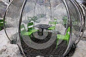 Clear plastic bubble tent an a restaurant terrace