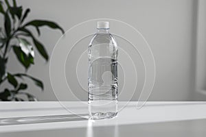 Clear plastic water bottle on a white table