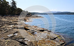 Clear pristine ocean with pebble beach on Vancouver Island in Nanoose park