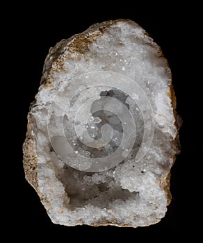 Clear quartz geode isolated on a black background photo