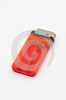 Clear red plastic gas lighter isolated on white