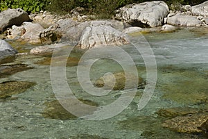 Clear river with cold water in dolomites