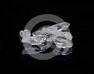 Clear Satyaloka Quartz from Southern India isolated on a black mirror background